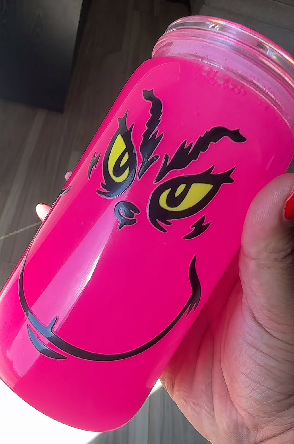 Pink Grinch face glows in the dark